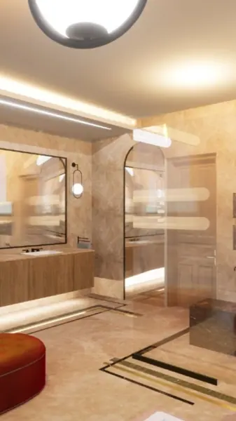 Warm beige natural stone is used for the bathroom walls and floor, alongside contrasting borders and a carefully composed floor pattern.