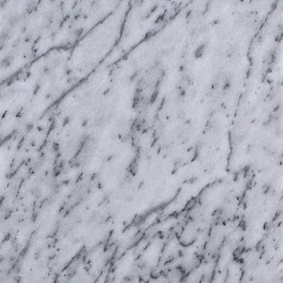 Adranos White | marble tile Adranos White marble tile — a cool white and soft grey palette, flowing diagonal veins that carry the eye across the stone