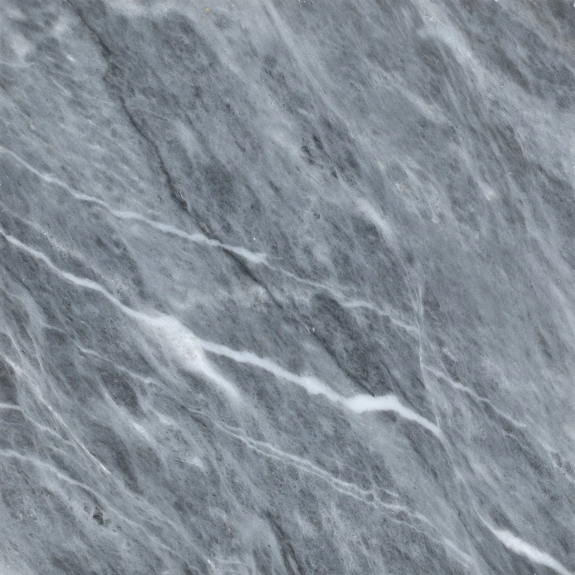 Demmer Afyon Gray | marble tile Demmer Afyon Gray marble tile — a balanced mid-grey background, flowing diagonal veins that carry the eye across the stone