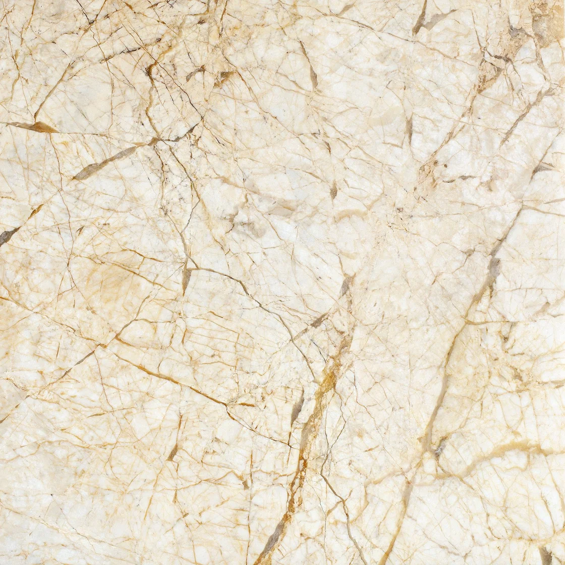 Golden Spider | marble tile Golden Spider marble tile — a soft ivory and cream background, fine golden-brown lines crossing the surface