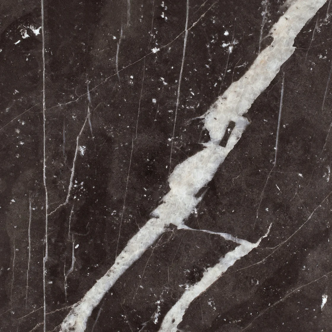 Montana Silver Ice | marble tile Montana Silver Ice marble tile — a near-black background, a bold white diagonal vein with finer intersecting lines
