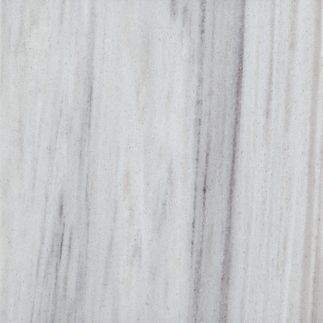 Skyline | marble tile Skyline marble tile — a cool white and soft grey palette, slender vertical streaks and softly blurred bands