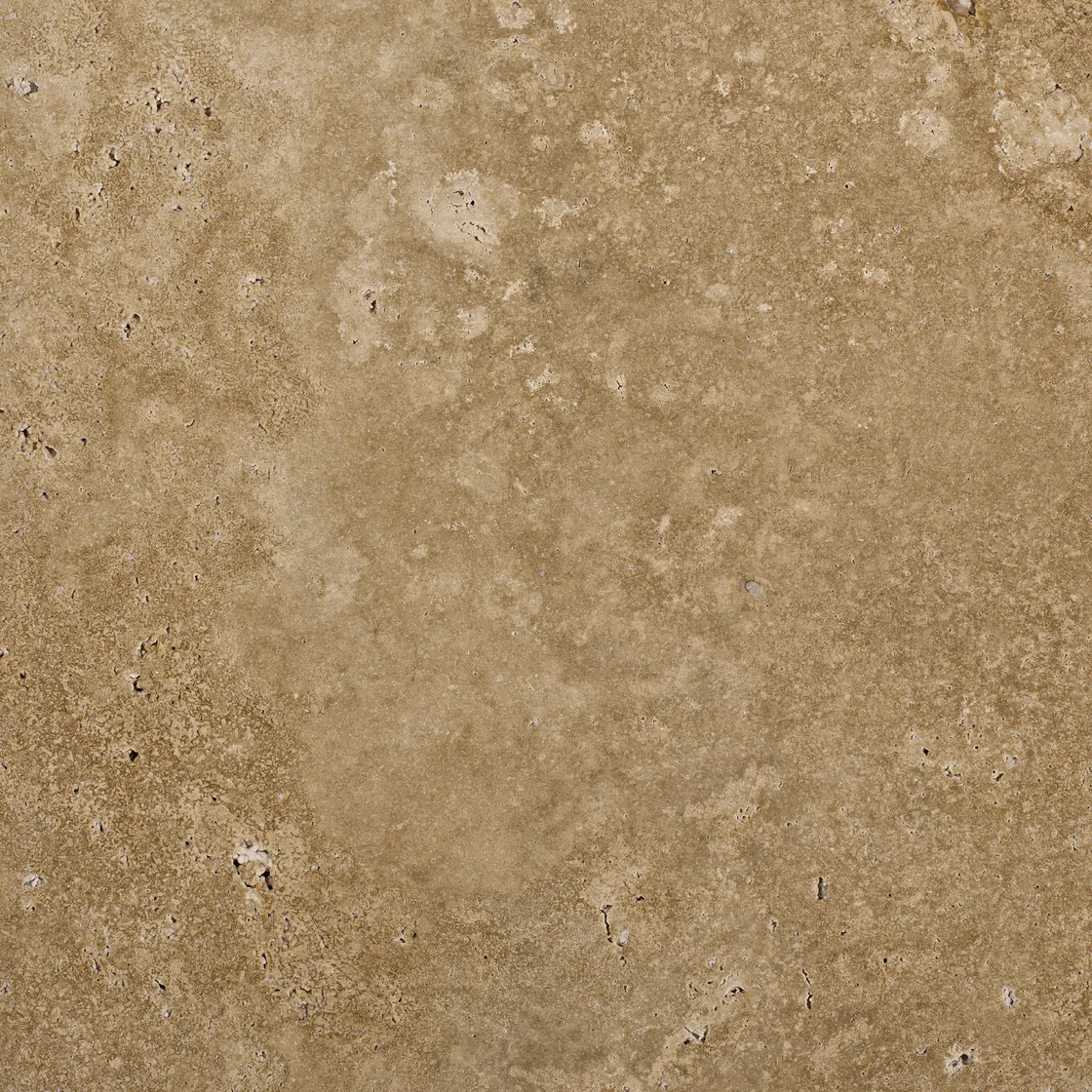 Warm Walnut | travertine tile Warm Walnut travertine tile — warm walnut-brown and cream tones, fine natural pores within a softly clouded pattern